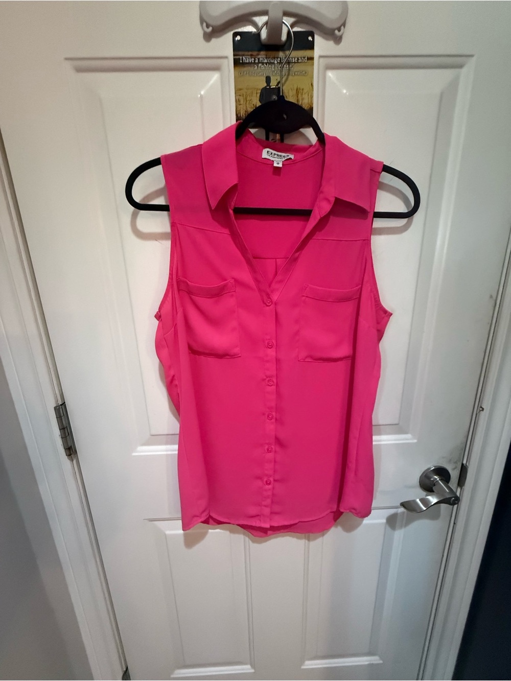 Vibrant pink sleeveless button-down top. This size medium Express The Portofino